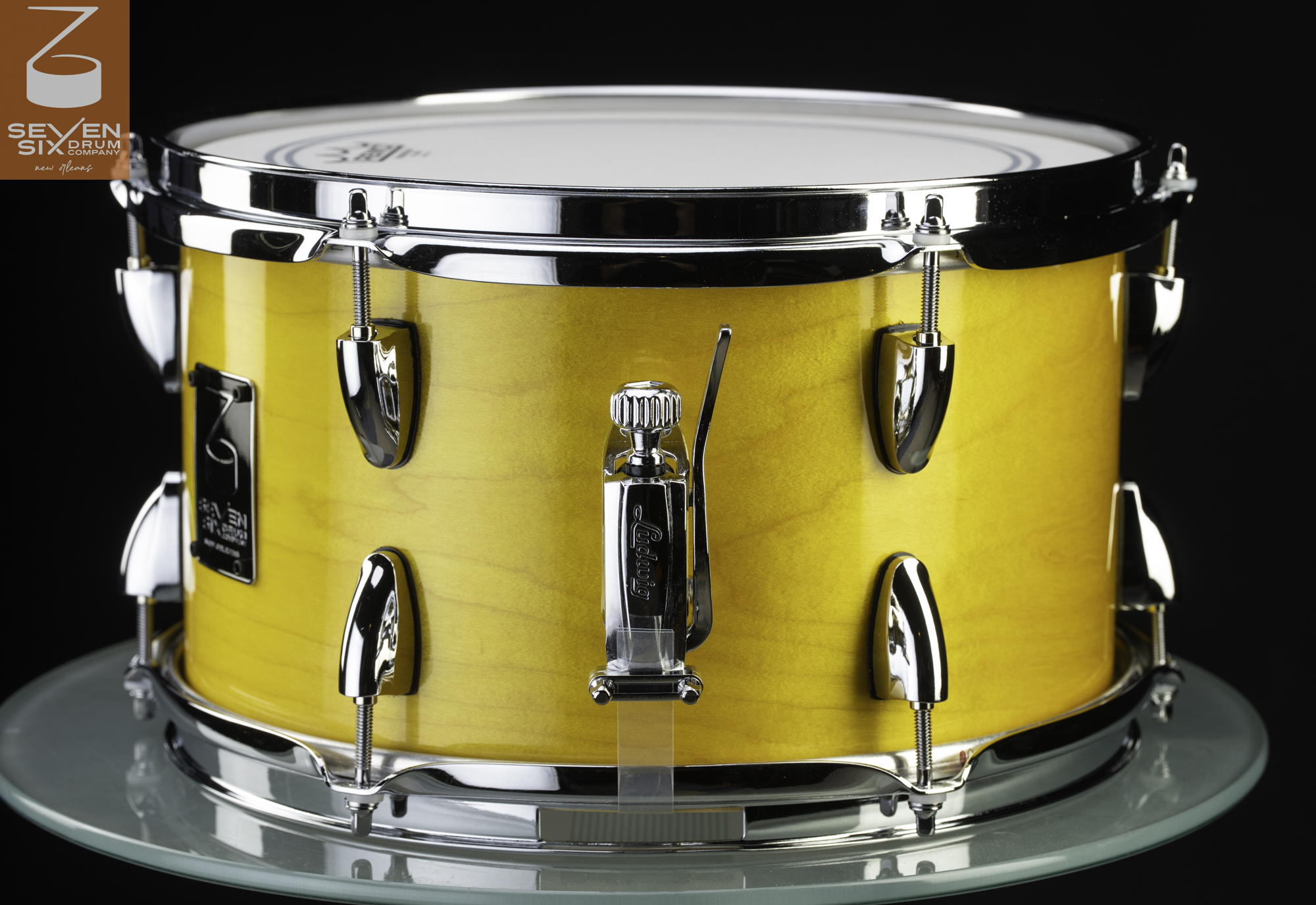Handmade snare drum with a gloss yellow wood finish, polished chrome hardware, and a Ludwig throw-off.