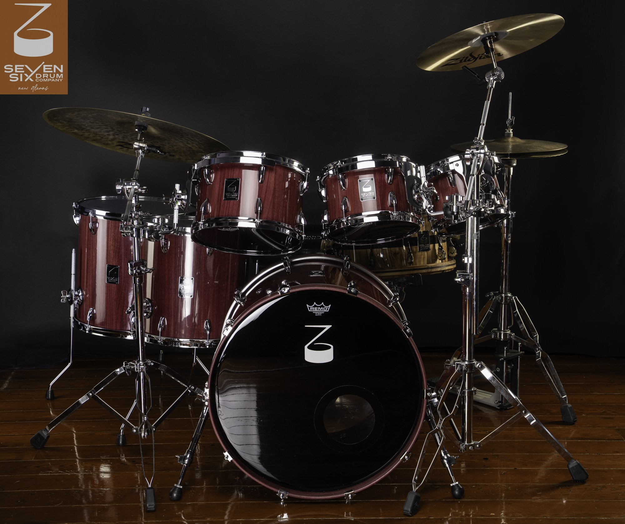 Handmade drum kit featuring glossy Prupleheart wood shells with polished chrome hardware and cymbals.