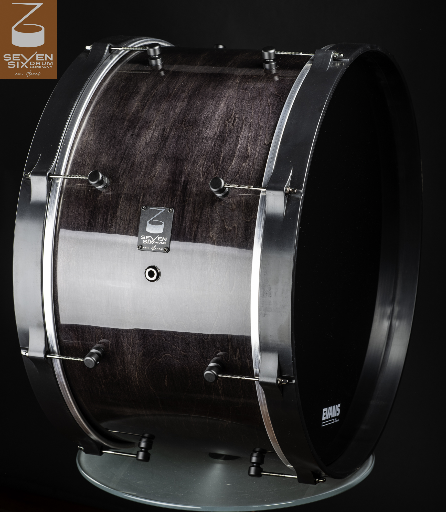 Dark stained  Ultralight Maple wood bass drum with a glossy finish, brushed metal hoops, and black lugs.